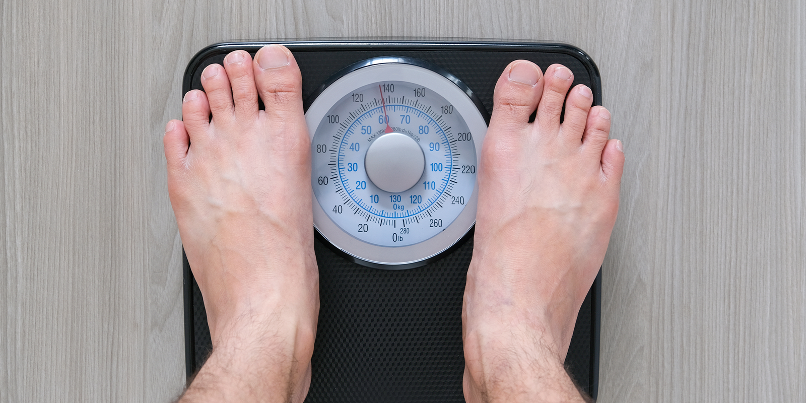 How does testosterone impact weight loss in men?